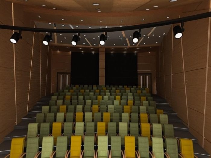 Delikli ahşap panel kaplı duvarlara sahip yeşil sarı koltuklu küçük sinema salonu görseli