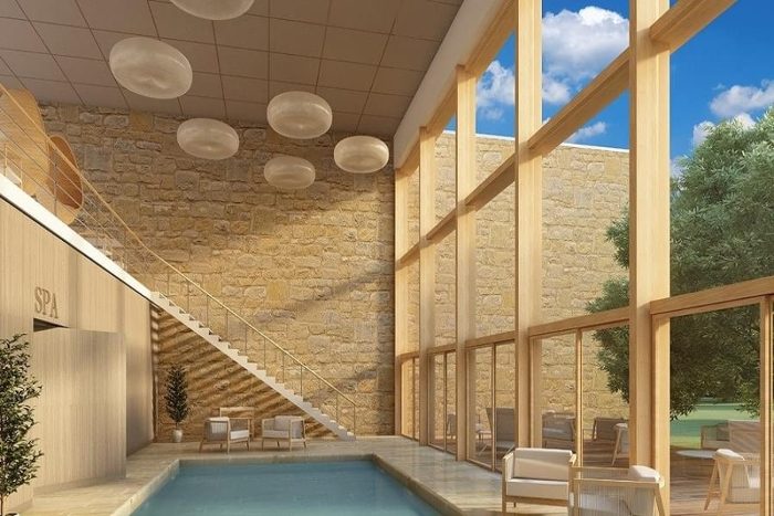 Kapalı yüzme havuzlu spa alanında tavana asılı oval bulut biçimli akustik kanopi panelleri