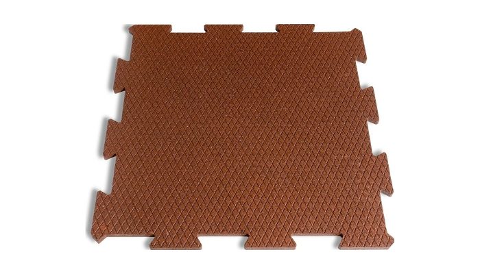 Puzzle dişli kiremit rengi kauçuk karonun dokulu üst yüzeyi